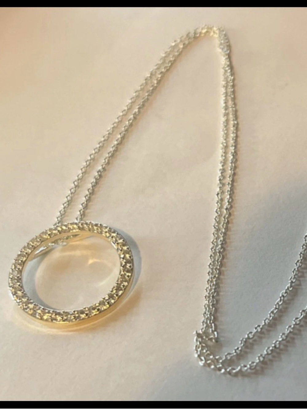 Delicate Silver Circle Pendant Necklace with Crystal Halo